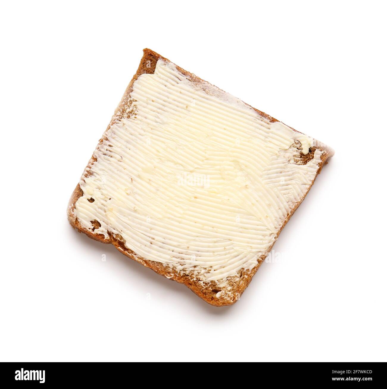 Slice of bread with butter on white background Stock Photo - Alamy