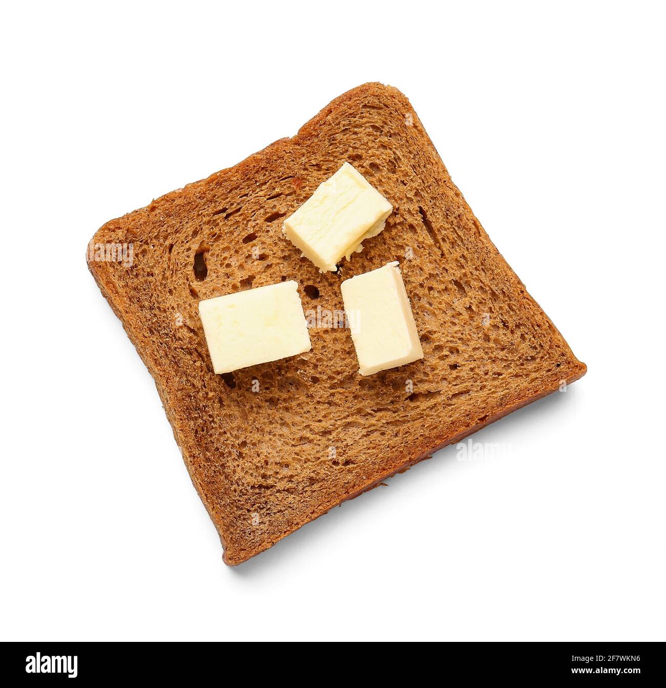 Slice of fresh bread with butter on white background Stock Photo - Alamy