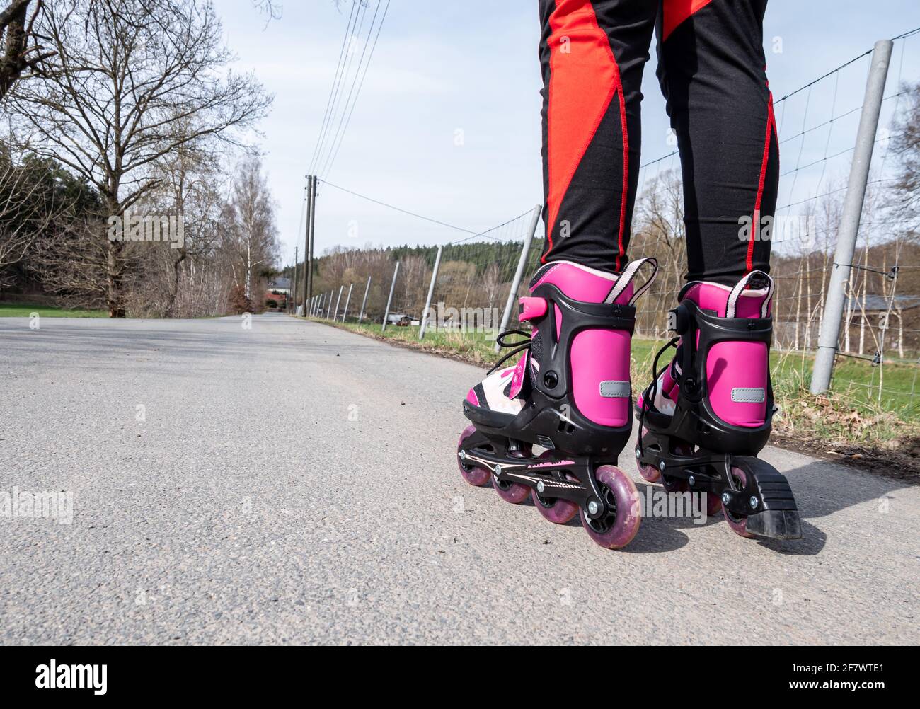 Girl inline skating on asphalt Stock Photo Alamy