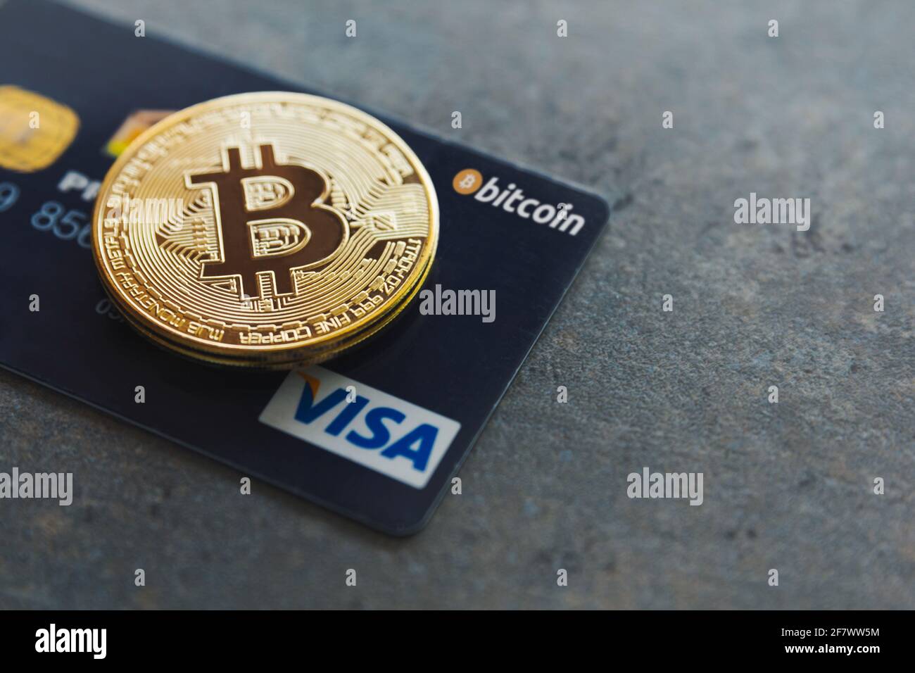 Valencia, Spain - April, 2021: A bitcoin and a Visa credit card on a  textured background. Pay with cryptocurrencies wherever you want in more  than 40 Stock Photo - Alamy