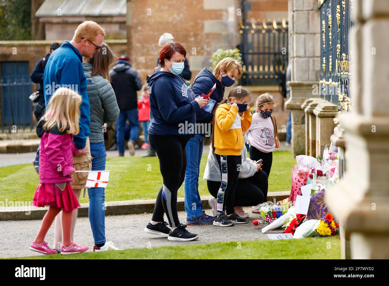 People lay flowers at Hillsborough Castle after Britain's Prince Philip, husband of Queen Elizabeth, died at the age of 99, in Hillsborough, Northern Ireland, April 10, 2021. REUTERS/Jason Cairnduff Stock Photo