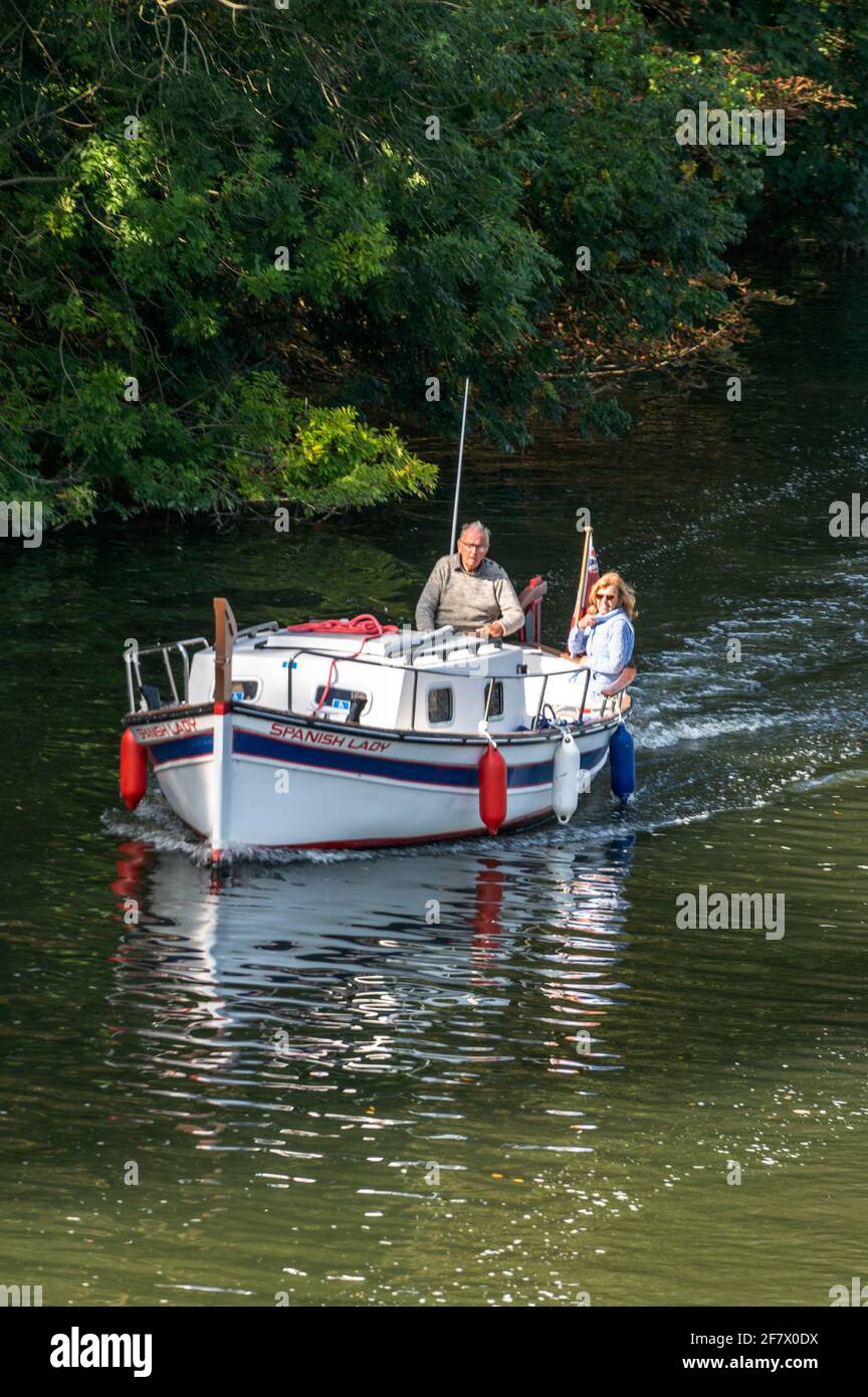 A wooden built river cruiser, ‘Spanish Lady,’ near Harleyford Marina between Hurley and Marlow on the River Thames in Buckinghamshire, Britain. Stock Photo