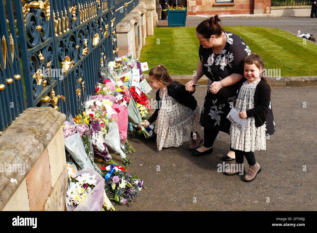 People lay flowers at Hillsborough Castle after Britain's Prince Philip, husband of Queen Elizabeth, died at the age of 99, in Hillsborough, Northern Ireland, April 10, 2021. REUTERS/Jason Cairnduff Stock Photo