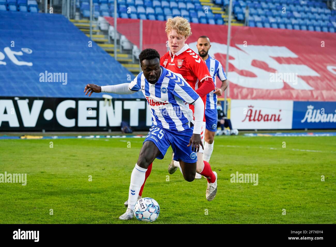 Odense, Denmark. 09th Apr, 2021. Moses Opondo (25) of OB and Tobias  Molgaard (44) of Vejle Boldklub seen during the 3F Superliga match between  Odense Boldklub and Vejle Boldklub at Nature Energy