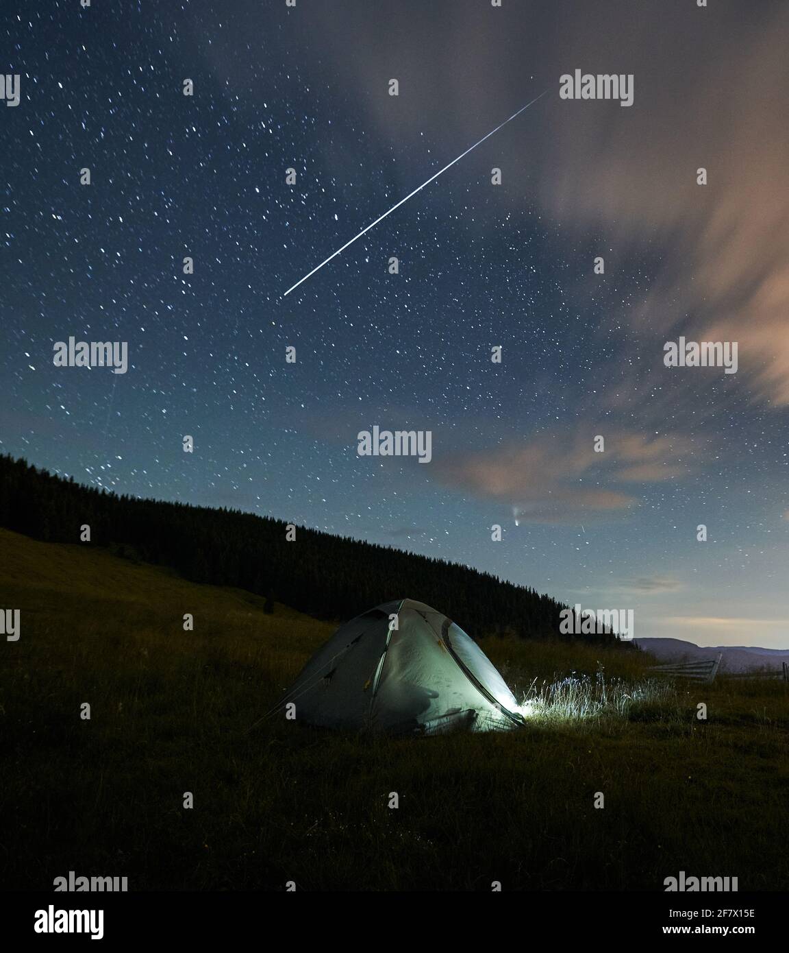 Tourist tent in mountains on incredible nature background. Concept of  wonderful starry sky at night and process relaxing Stock Photo - Alamy