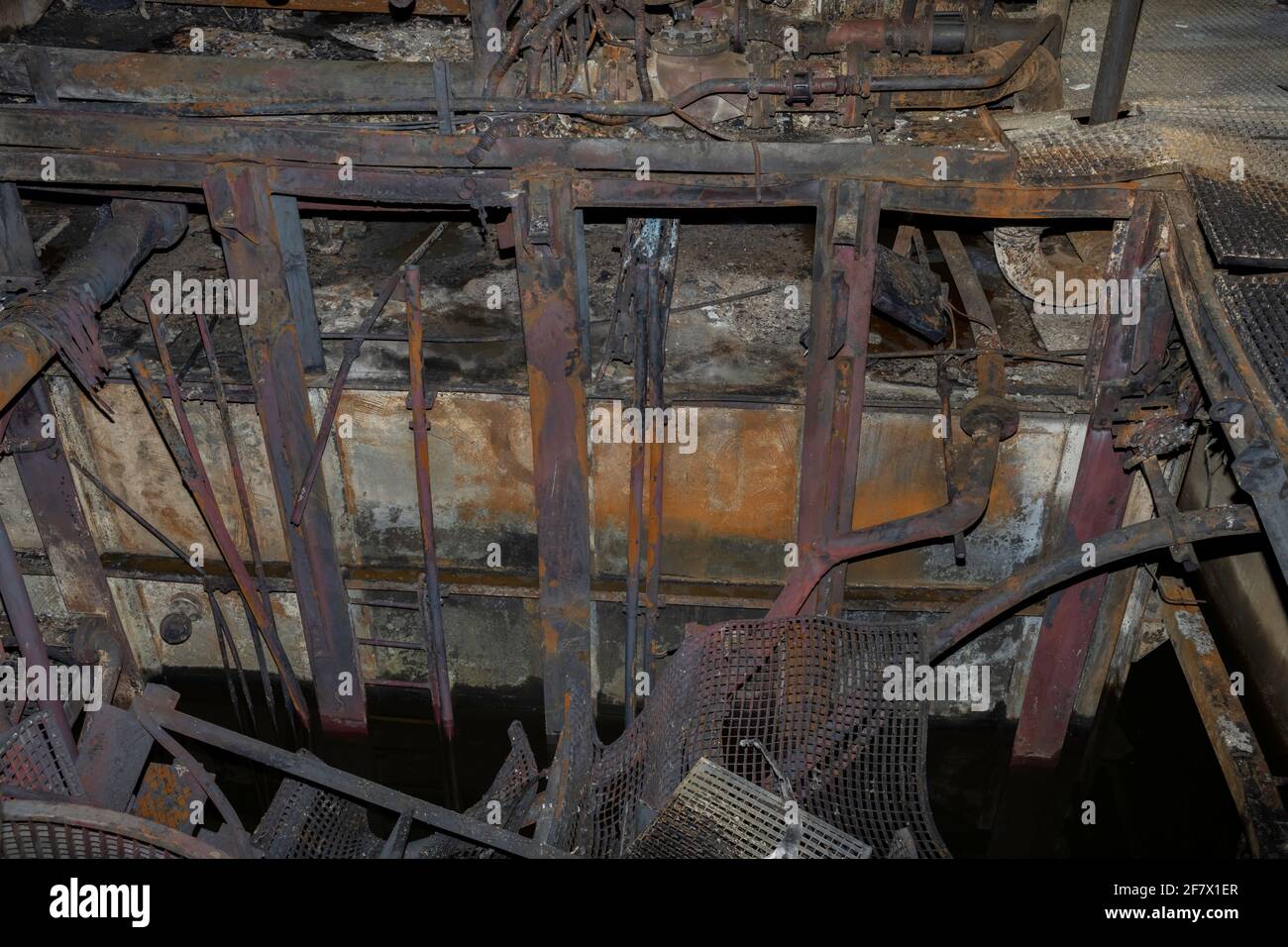 metal structure with pipes, and floor collapsed after a fire Stock Photo