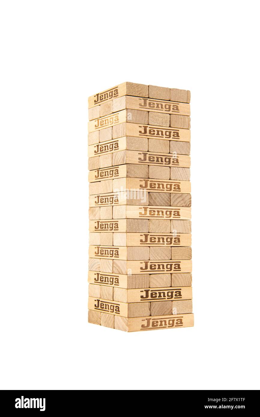 Jenga Tower at the start of the game on a white background Stock Photo