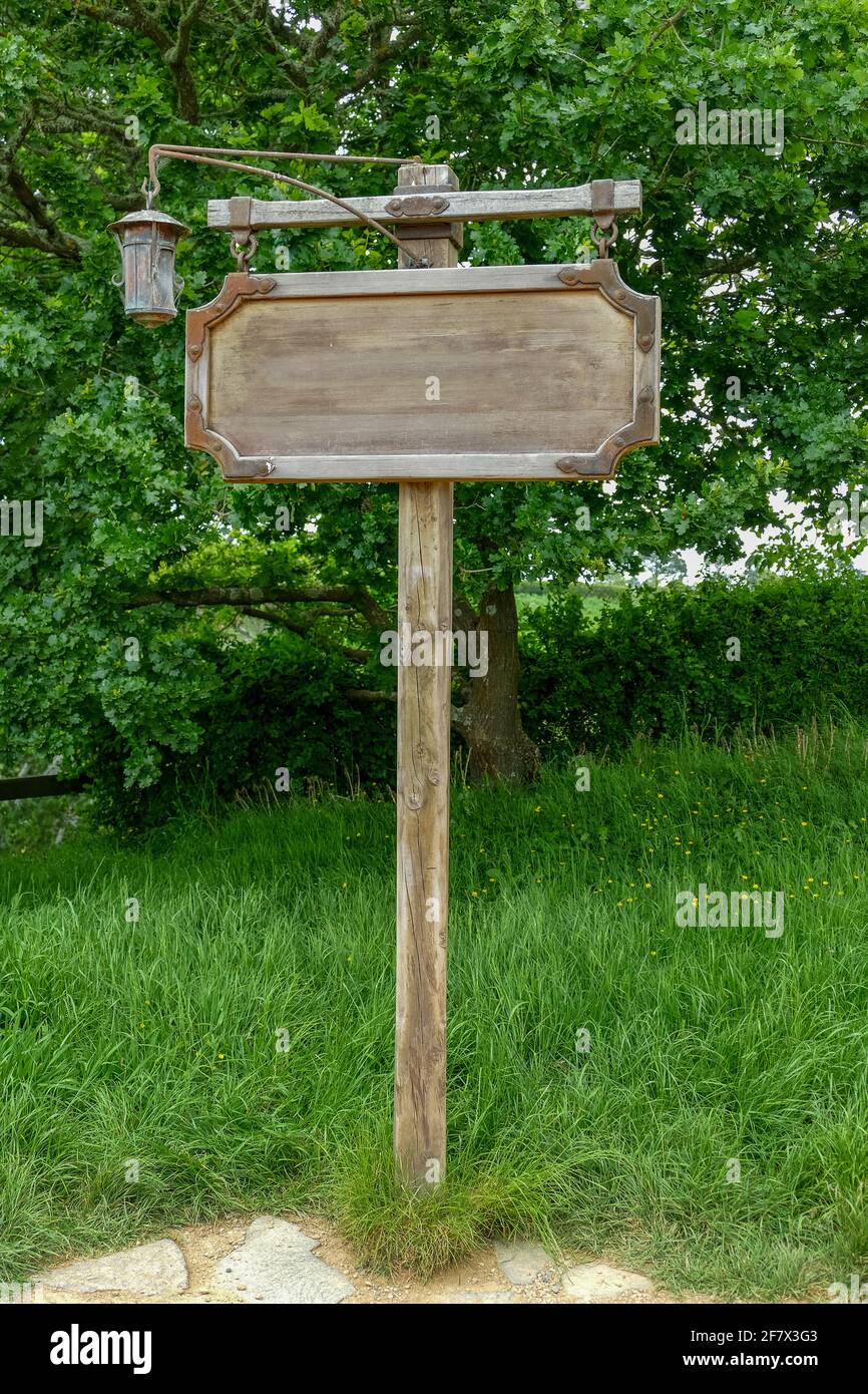 old wooden sign in green ambiance Stock Photo