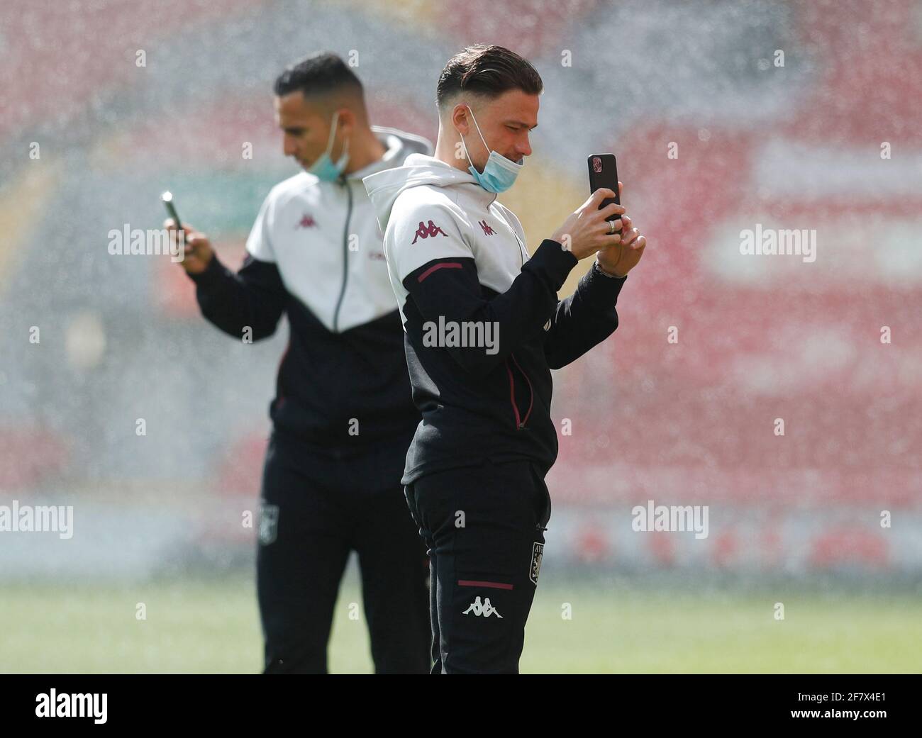 Liverpool, England, 10th April 2021. Matty Cash of Aston Villa takes pictures with his phone as he walks on the pitch before the Premier League match at Anfield, Liverpool. Picture credit should read: Darren Staples / Sportimage Credit: Sportimage/Alamy Live News Stock Photo