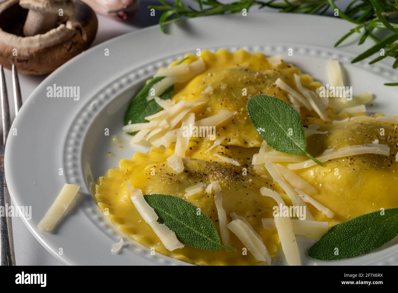 Mushroom and cheese stuffed ravioli with olive oil. Stock Photo