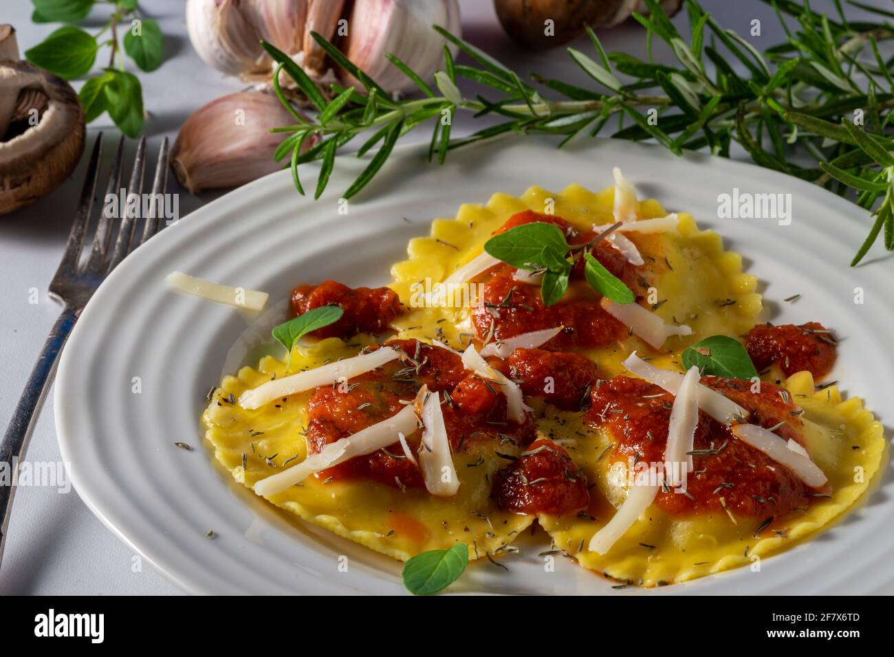 Mushroom and cheese stuffed ravioli with marinara sauce. Stock Photo