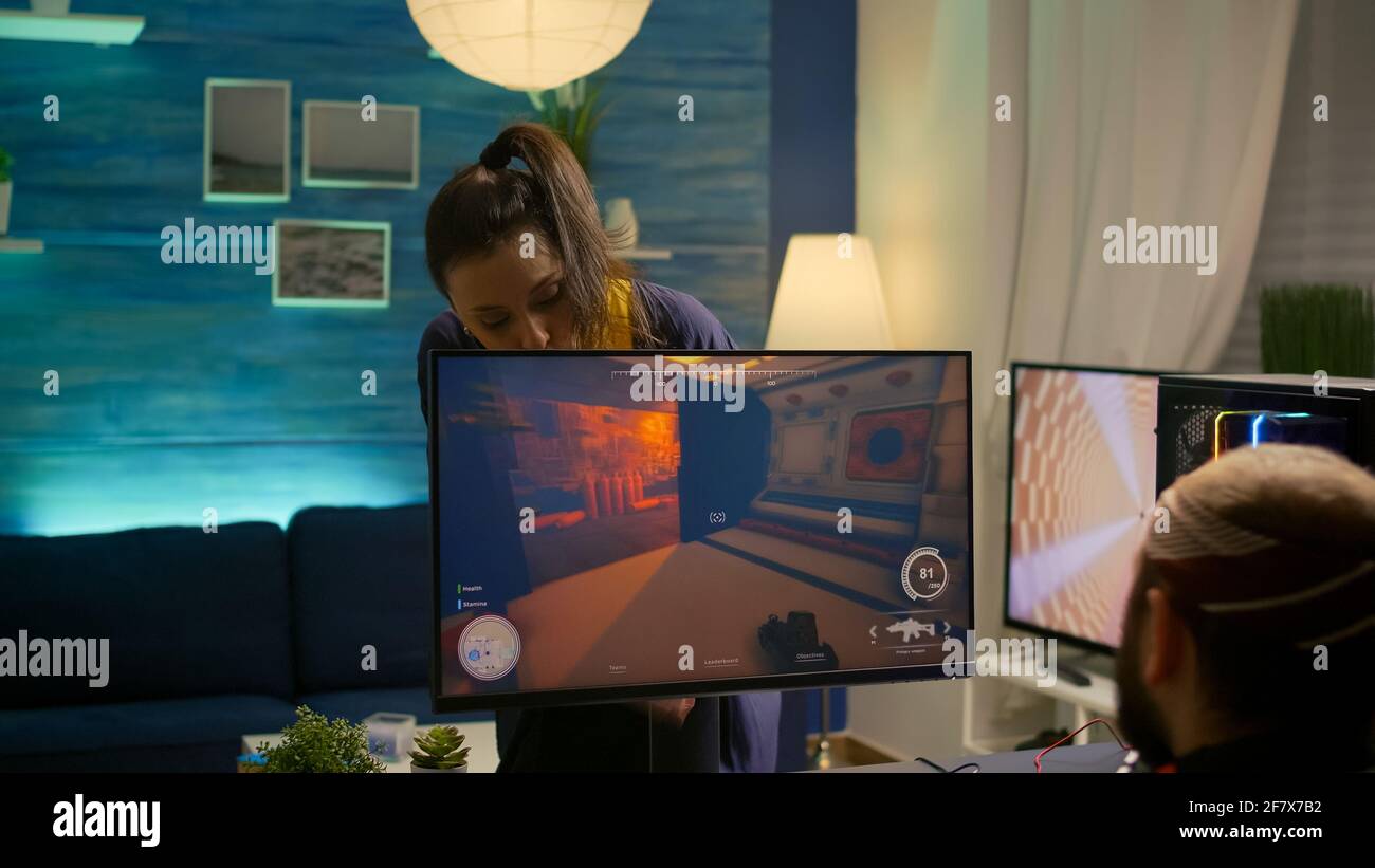 Cyber gamer fight with girlfriend about playing first person shooter video  game for online competition. Pro player performing on powerful pc in gaming  room home during online tournament Stock Photo - Alamy