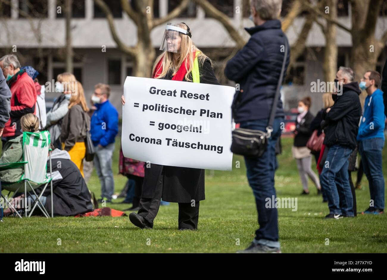 10 April 2021, Baden-Wuerttemberg, Heilbronn: 'Great Reset = political plan = google! - Corona deception' is written on the sign of a participant of a demonstration of the initiative 'Querdenken'. The demonstration is directed against the pandemic restrictions of the federal government. Photo: Christoph Schmidt/dpa Stock Photo