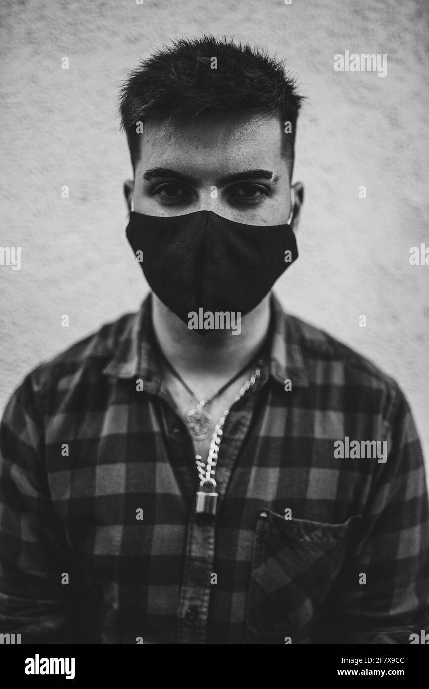 Man wearing black face mask Black and White Stock Photos & Images - Alamy