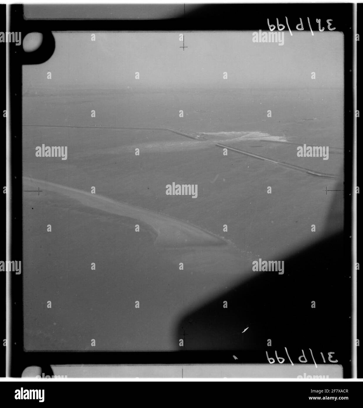 Watershortage disaster 1953. Air photo of the brokenthrough dike at