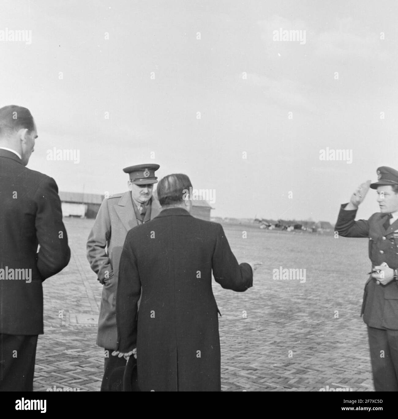 Visit from the Canadian General Charles Foulkes to the Netherlands in May 1948. Arrival at the Valkenburg flying camp. In the background, vaguely showing a few Fairey Firefly aircraft from the MLD. Stock Photo