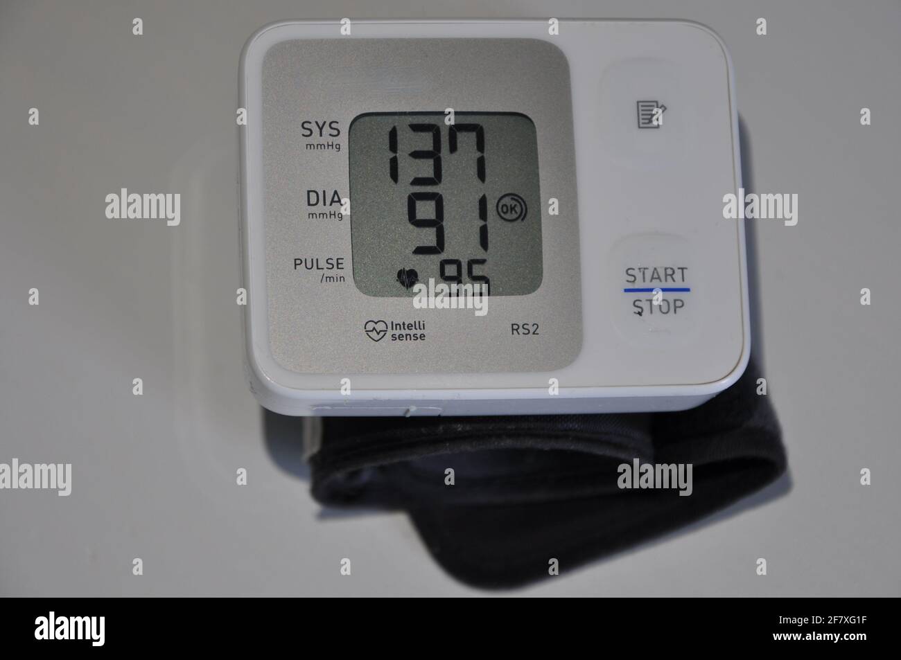 Stock Photo - Digital blood pressure monitor on white background. Cardiology equipment Stock Photo