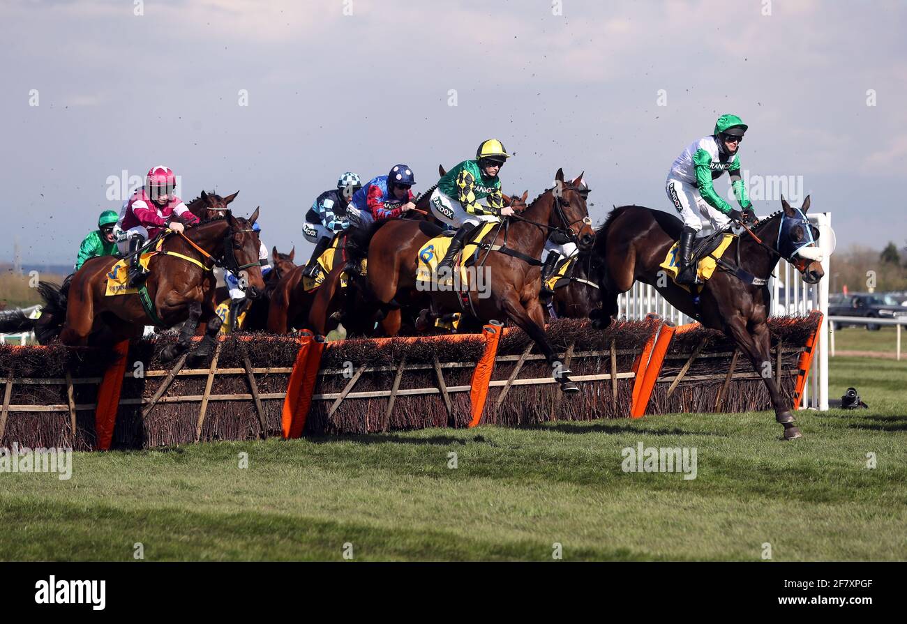 Runners and riders clear a fence during the Ryanair Stayers Hurdle on