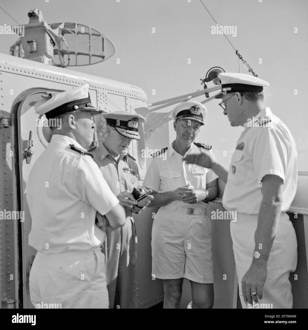 Meeting between the commander of the Matchmaker III Squadron, Captain at  sea F. Visee, a vice-admiral RN, the commander of HR. Ms. Limburg, Captain  Lieutenant at sea J. Jansen, and a Rear-Admiral