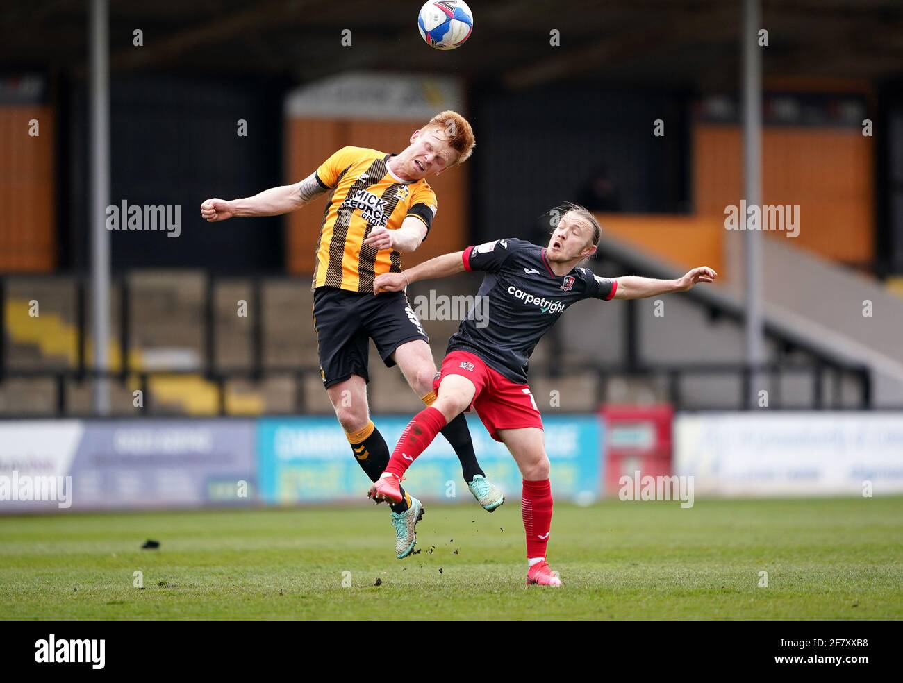 Cambridge United's Liam O'Neil (left) and Exeter City's Matt Jay battle for the ball during the Sky Bet League Two match at the Abbey Stadium, Cambridge. Picture date: Saturday April 10, 2021. Stock Photo