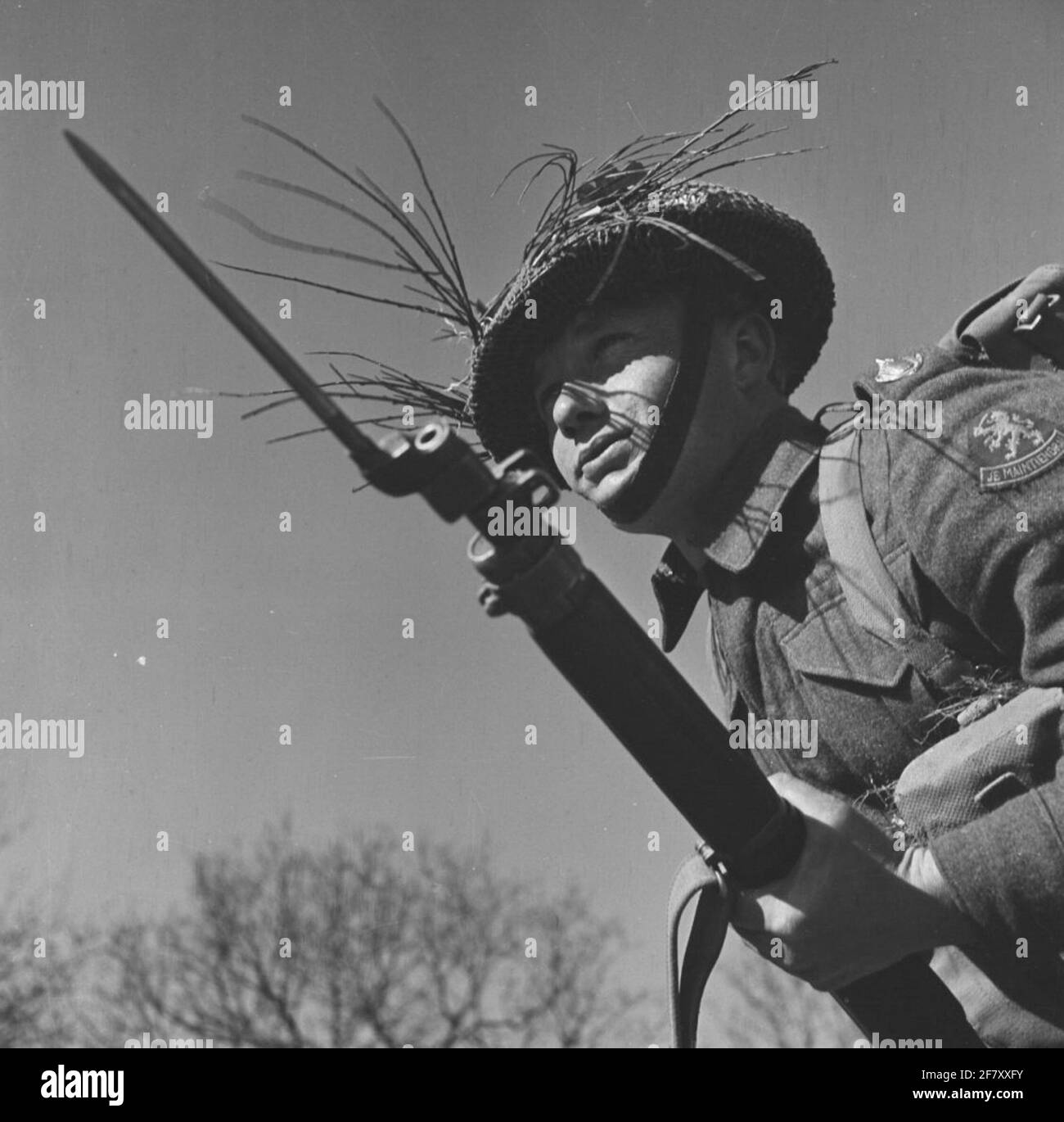 Infanterist with Lee Enfield rifle during a field service exercise. Here with stuffed nail bayonet. Stock Photo