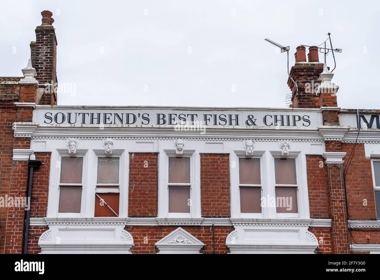 Southend's best fish & chips, sign above Van Looys fish and chip shop in Southend on Sea, Essex, UK. Historic architecture Stock Photo