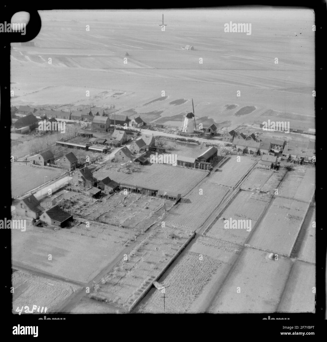 Watersnoodramp 1953. Air photo of Nieuwe-Tonge with an overview of the area affected by the disaster. Middle mill d'Oranjeboom on the Molendijk. Stock Photo