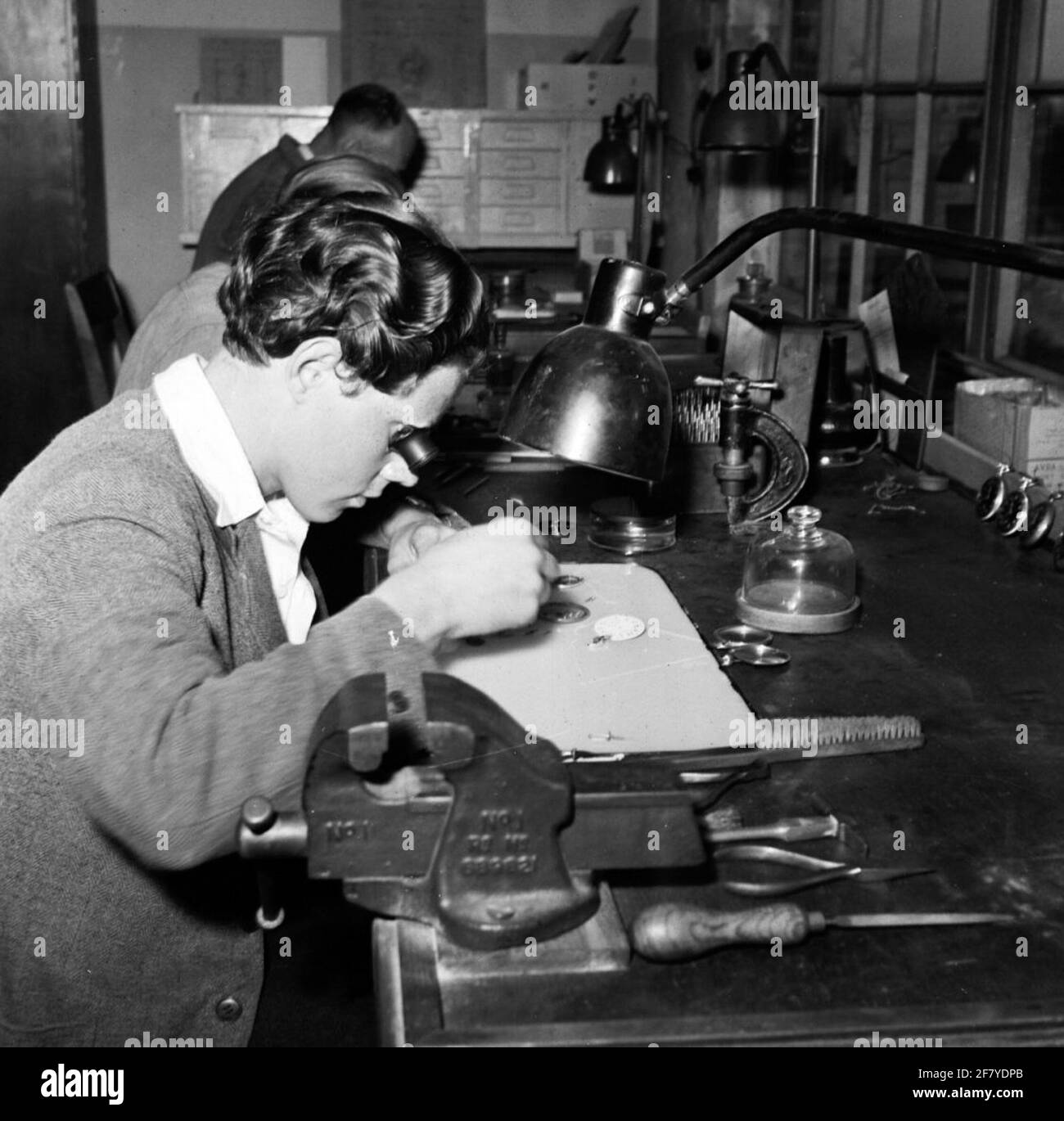 A watchmaker busy with the repair of stopwatches Stock Photo Alamy