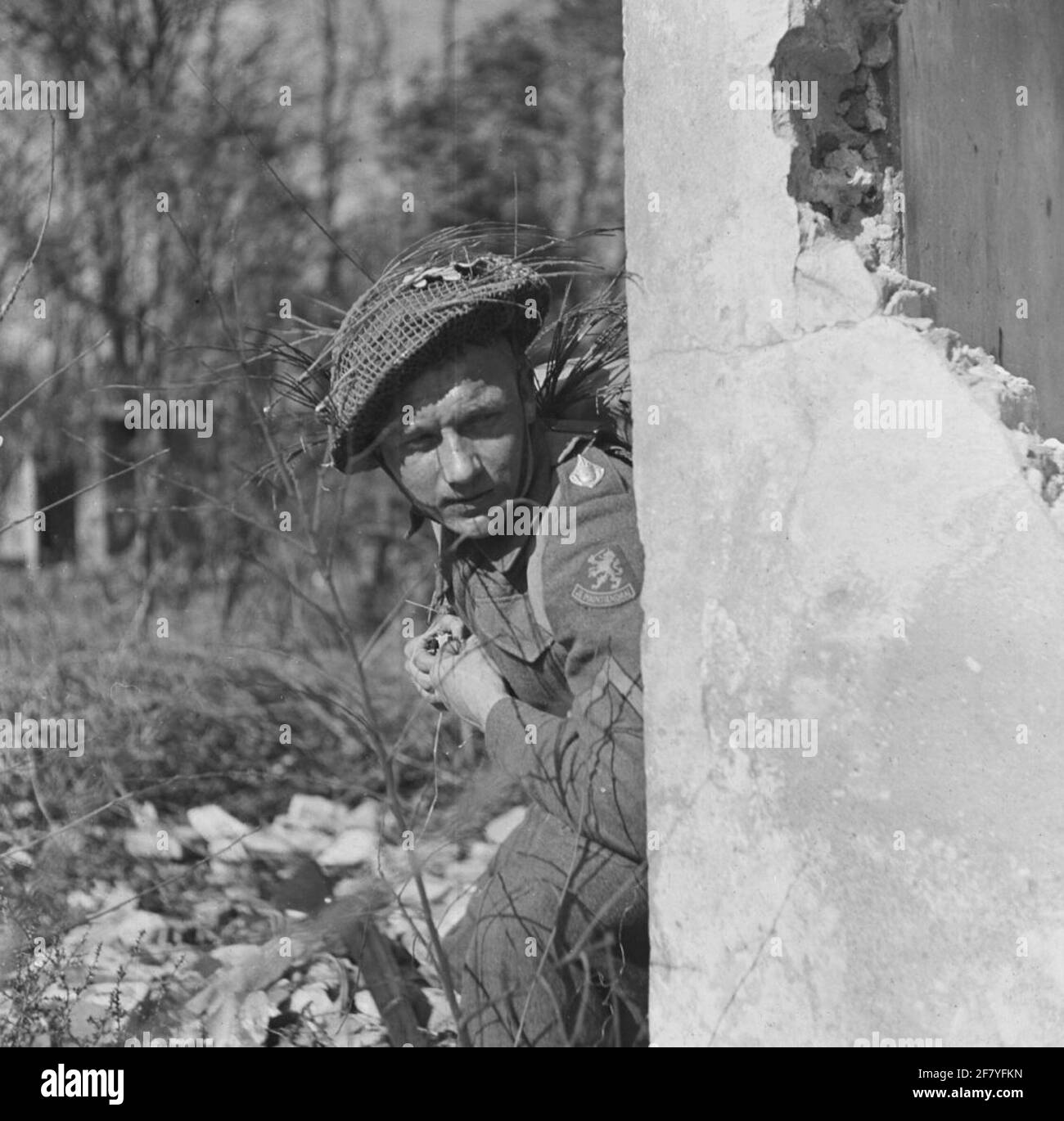 An infanterist ready to throw a (exercise) hand grenade. Stock Photo