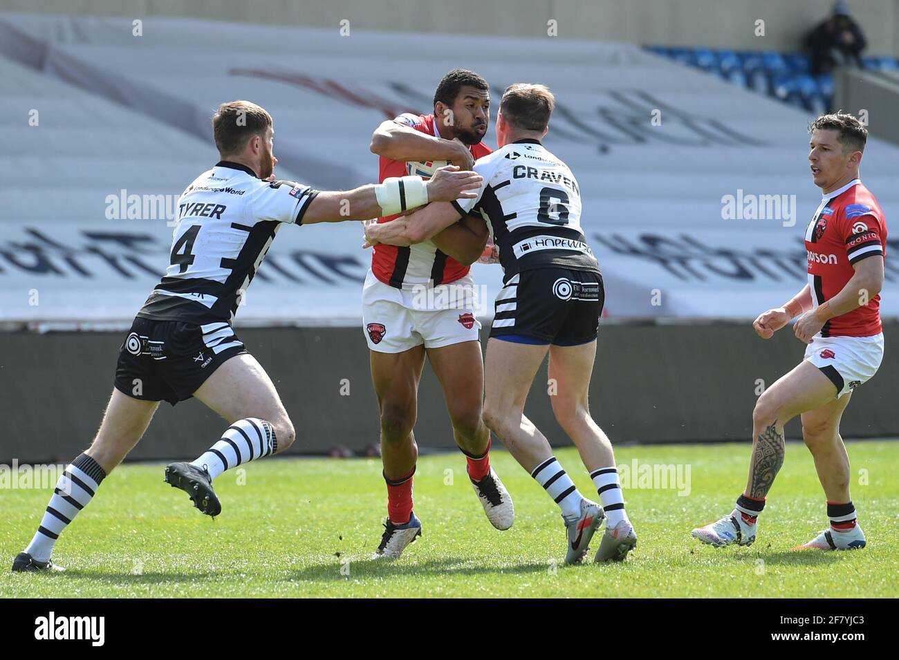 Eccles, UK. 10th Apr, 2021. Kallum Watkins (3) of Salford Red Devils is tackled by Danny Craven (6) of Widnes Vikings in Eccles, UK on 4/10/2021. (Photo by Richard Long/News Images/Sipa USA) Credit: Sipa USA/Alamy Live News Stock Photo