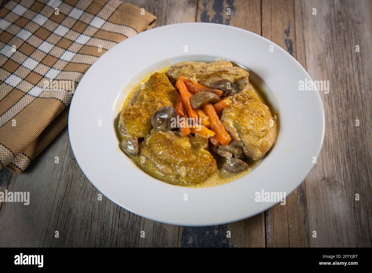 Recipe for chicken fricassee in white wine, with a carrot and mushroom planter Stock Photo Alamy