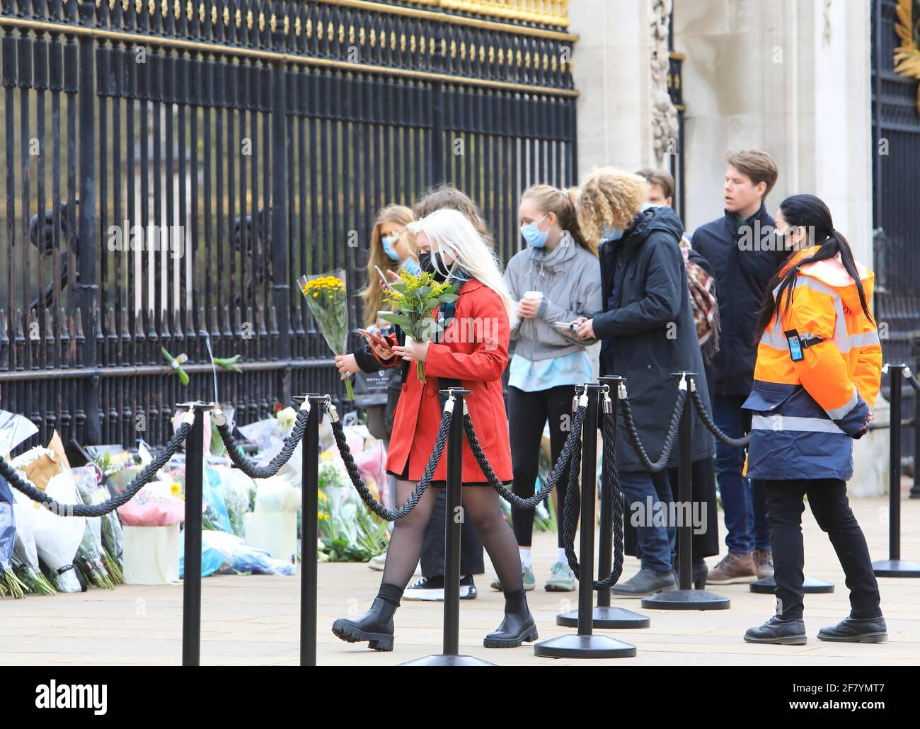 London, UK April 10th 2021. People queued up to lay flowers and pay their respects outside Buckingham Palace in tribute to HRH Prince Philip, who died on Friday at the age of 99, just 2 months short of his 100th birthday. Monica Wells/Alamy Live News Stock Photo