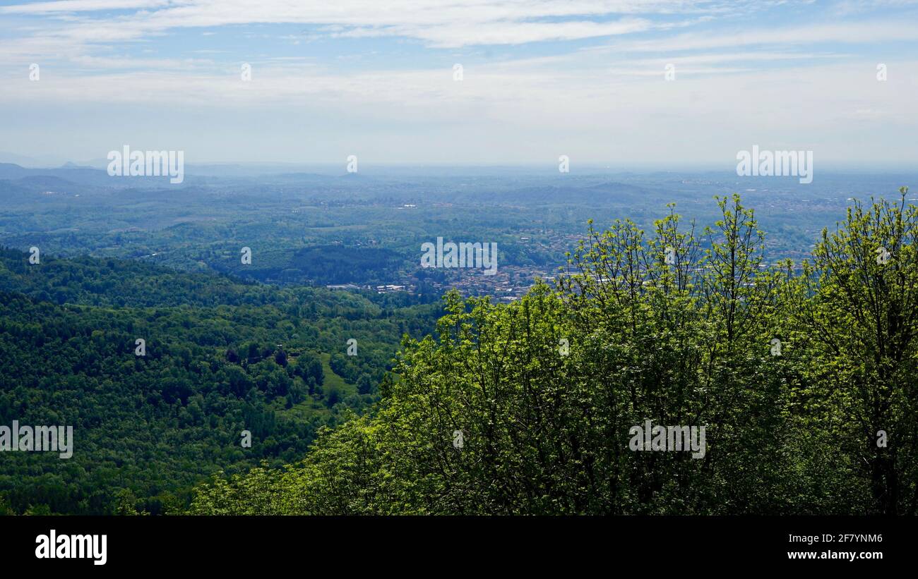 Green mountain of Sacro Monte in a sunny day with blue sky. Stock Photo