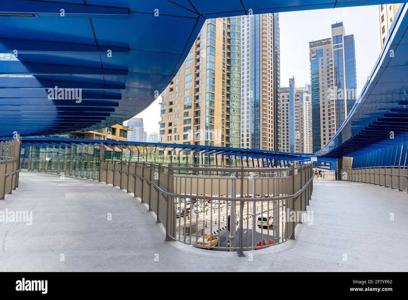 Dubai, UAE, 22.02.2021. Marina Pedestrian Bridge footbridge at the intersection of King Abdullah Bin Abdulaziz Al Saud Street and Al Gharbi Street. Stock Photo