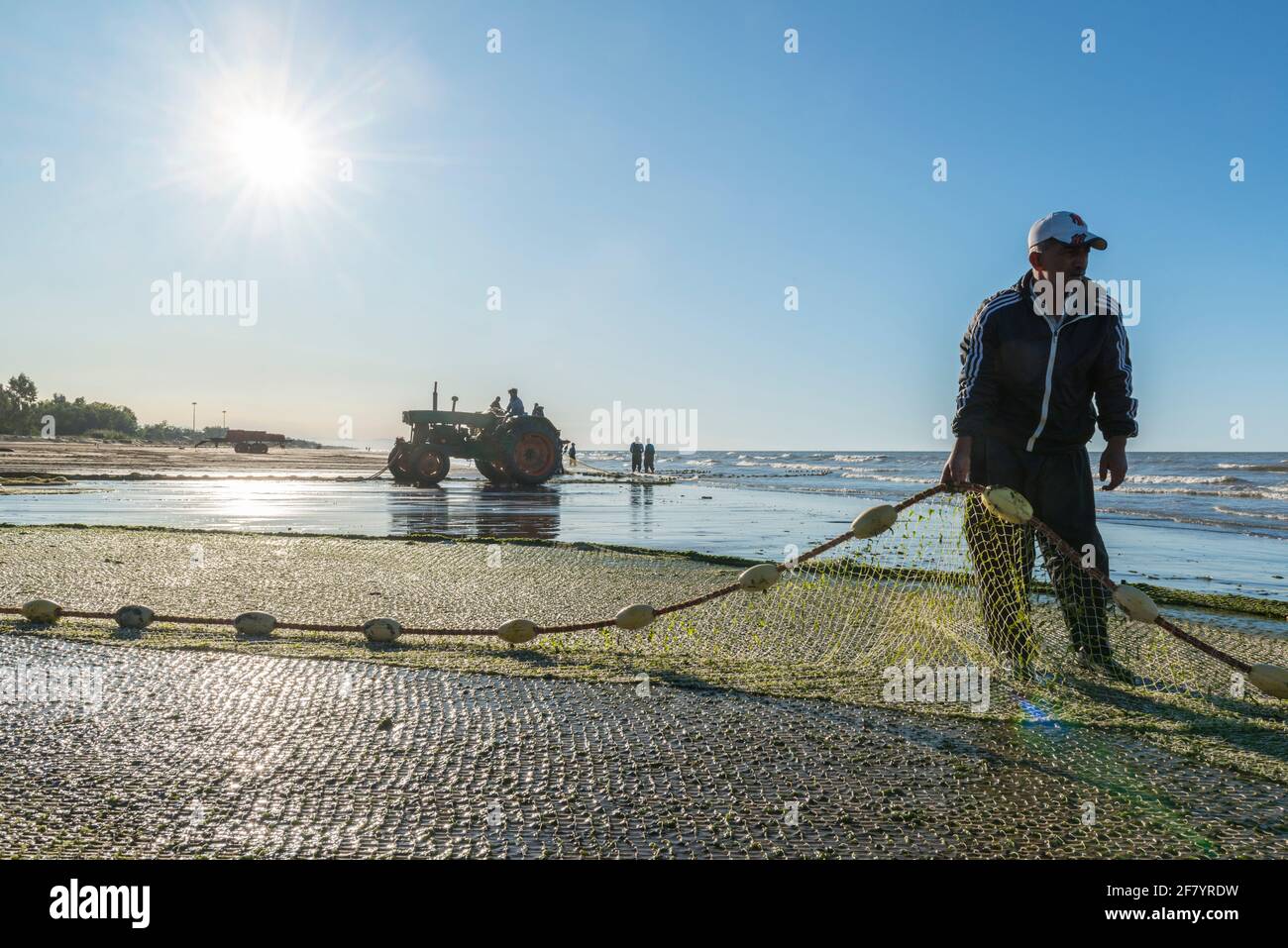 Fishermen hauling in the catch in Babolsar on the Caspian Sea. Iran Stock Photo