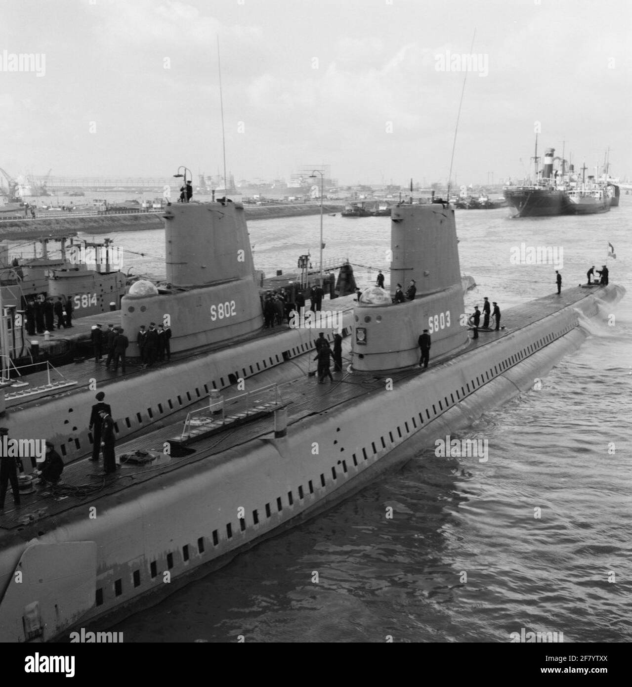 Arrival in March 1958 at the sub-sea service (OZD) at the Waalhaven in Rotterdam of the submarines Hr.Ms. Walrus (S 802, Left) and Hr.Ms. Sea lion (S 803, right) After their journey to South America, where by the Walrus in the context of the Dutch contribution to the geophysical year gravity measurements were carried out.Linces behind lies the submarine Hr.Ms. Swordfish (S 814). Stock Photo