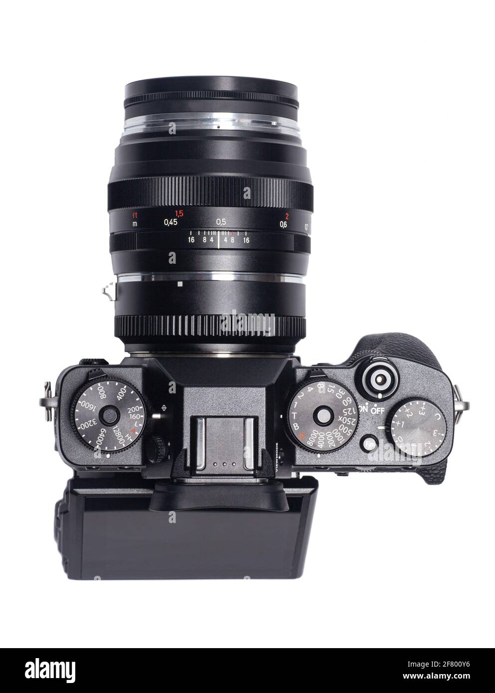 Mirrorless digital camera with flash isolated on white background Stock