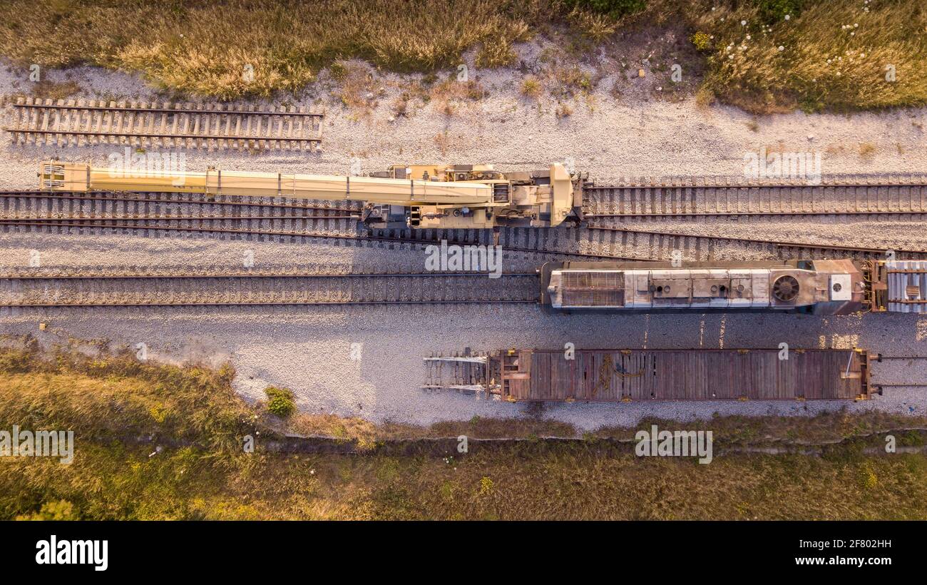 Railroad workers repairing a broken track.Rail tracks maintenance process.  Stock Photo