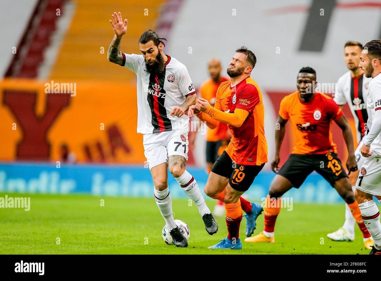 ISTANBUL, NETHERLANDS - APRIL 10: Jimmy Durmaz of Fatih Karagumruk, Omer Bayram of Galatasaray during the Super lig match between Galatasaray SK and F Stock Photo