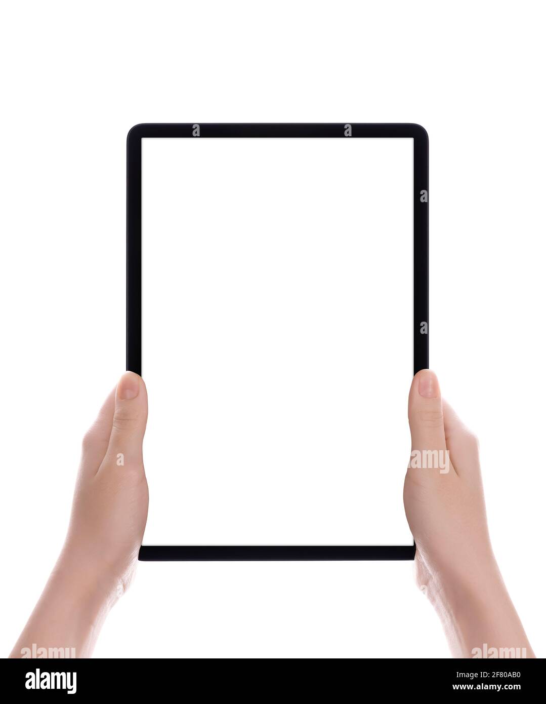 Hands holding a tablet computer with white screen. Woman hands showing empty screen of modern digital tablet. Hand holding tablet pc isolated on white Stock Photo