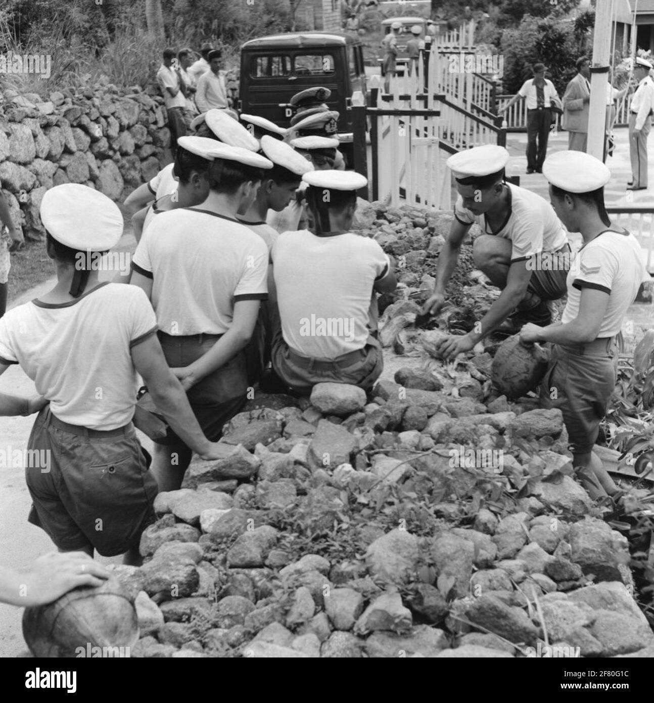 Clapper heels through crew members from Kruiser Hr.Ms. De Ruyter (C 801 ...