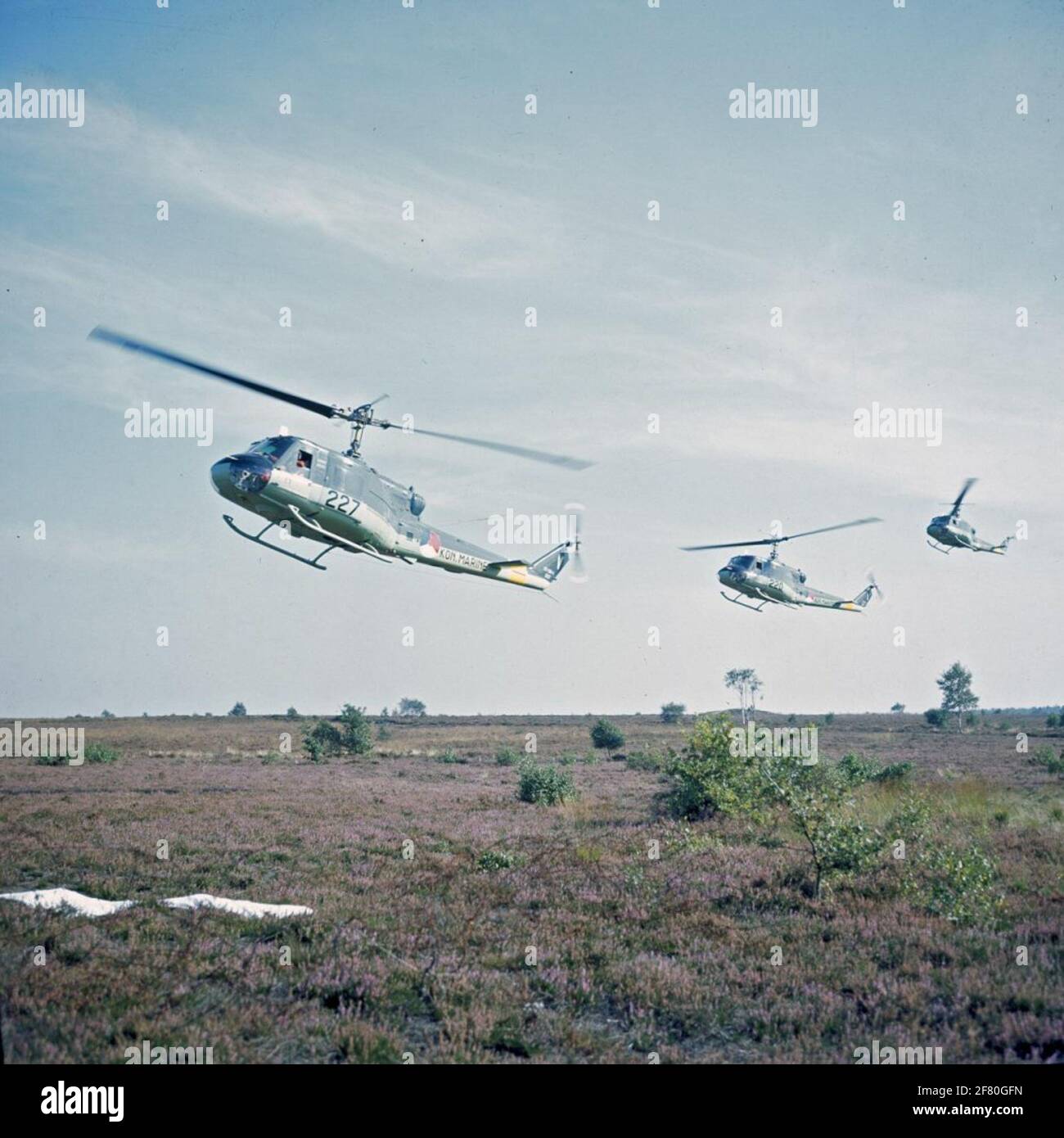 Three Agusta-Bell 204B (I) UH-1 Air Sea Rescue (ASR) helicopters (1962-1978) above the heath. Stock Photo