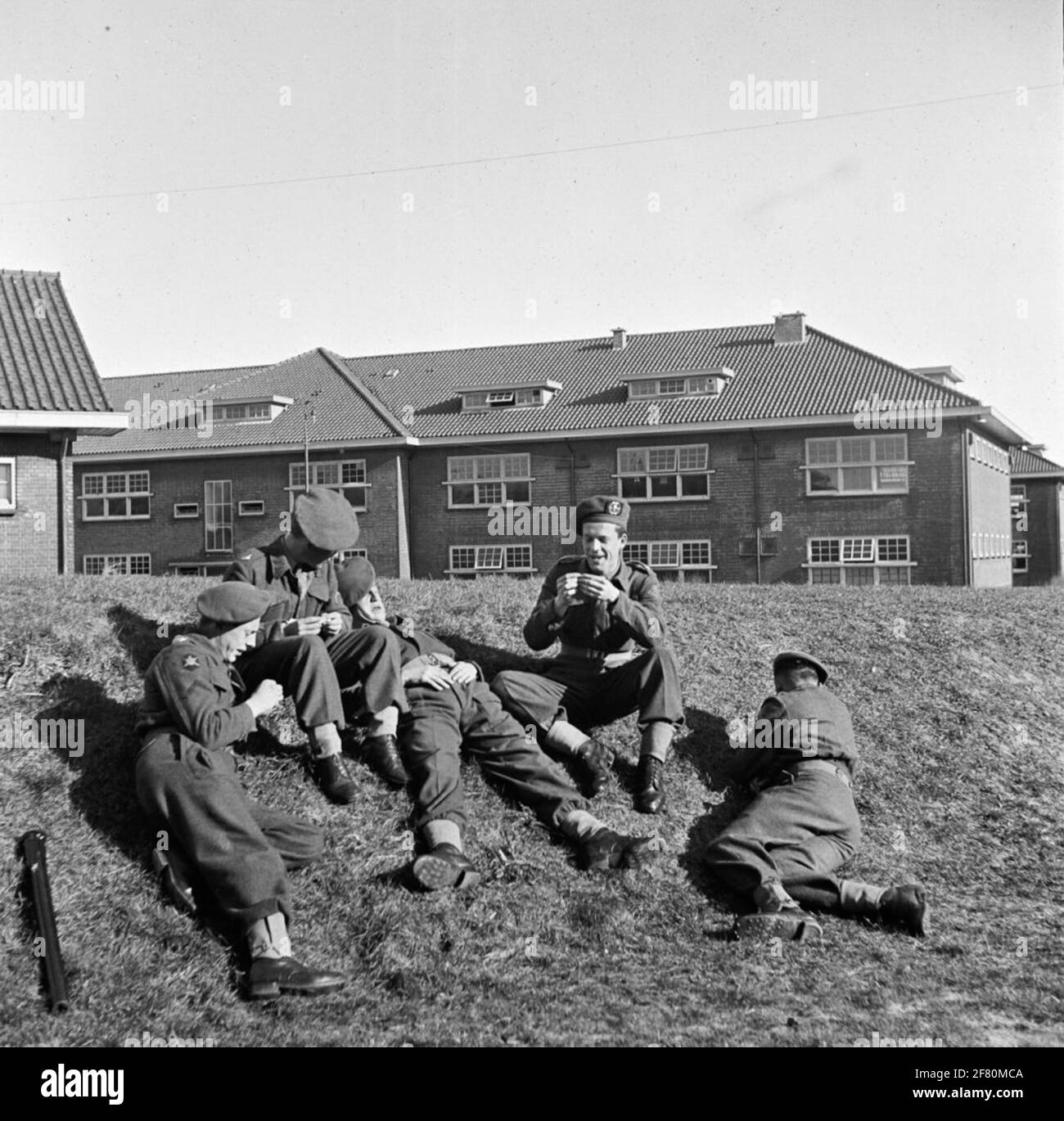 Five Infantrymen Have A Break On A Barracks In The Hague Stock Photo five-infantrymen-have-a-break-on-a-barracks-in-the-hague-stock-photo
