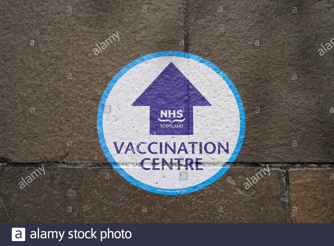 NHS Scotland Covid-19 Coronavirus Vaccination Centre directions on pavement, Edinburgh, Scotland Stock Photo