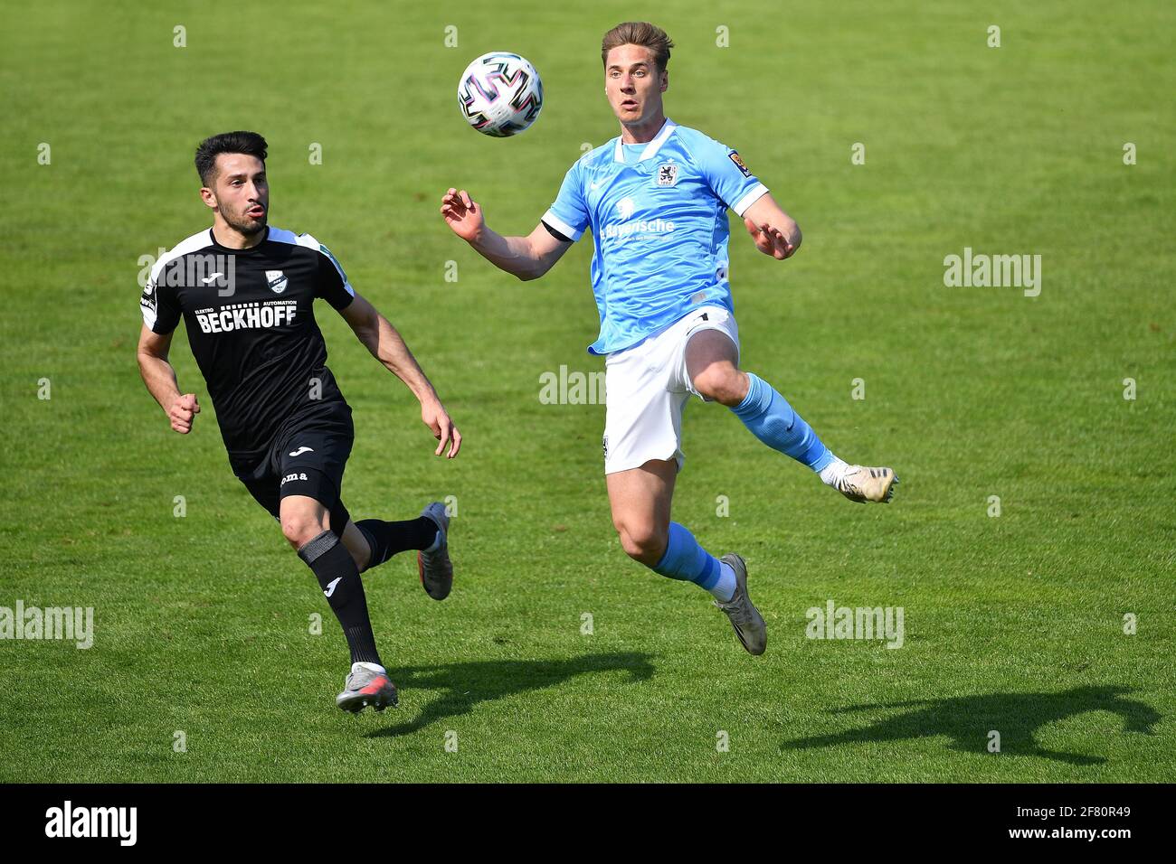 Muenchen GRUENWALDER STADION. 10th Apr, 2021. Mael CORBOZ (Verl), action,  duels versus Dennis DRESSEL (TSV Munich 1860). Soccer 3rd league, Liga3, TSV  Munich 1860 - SC Verl 3-2, on April 10th, 2021