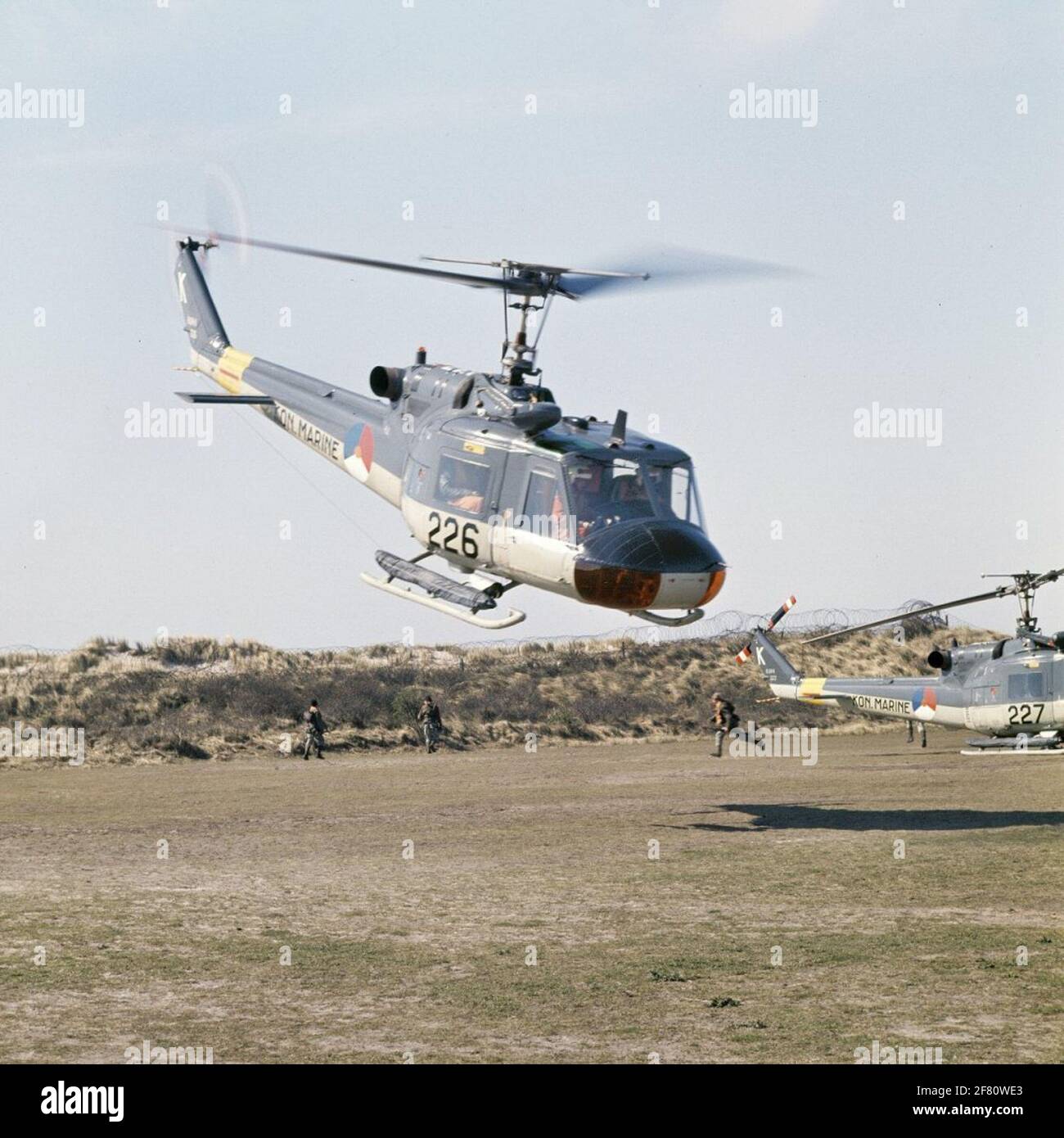 The Agusta-Bell 204B (I) UH-1 Air Sea Rescue (ASR) / Transport helicopters 225 (1963-1977) and 227 (1963-1977) practicing with Marines. Stock Photo