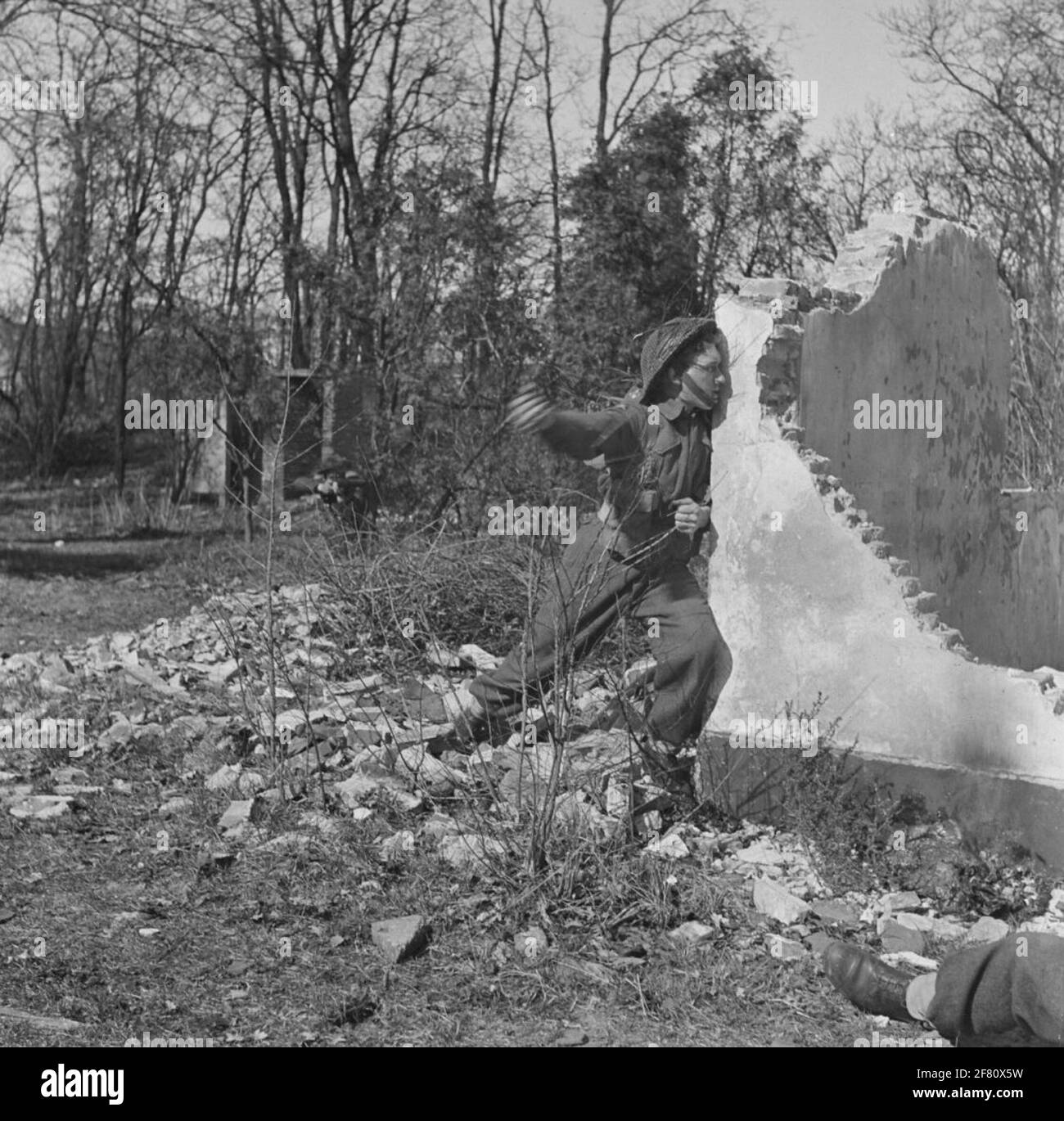 An infantryman throws hand grenade on an exercise location Stock Photo