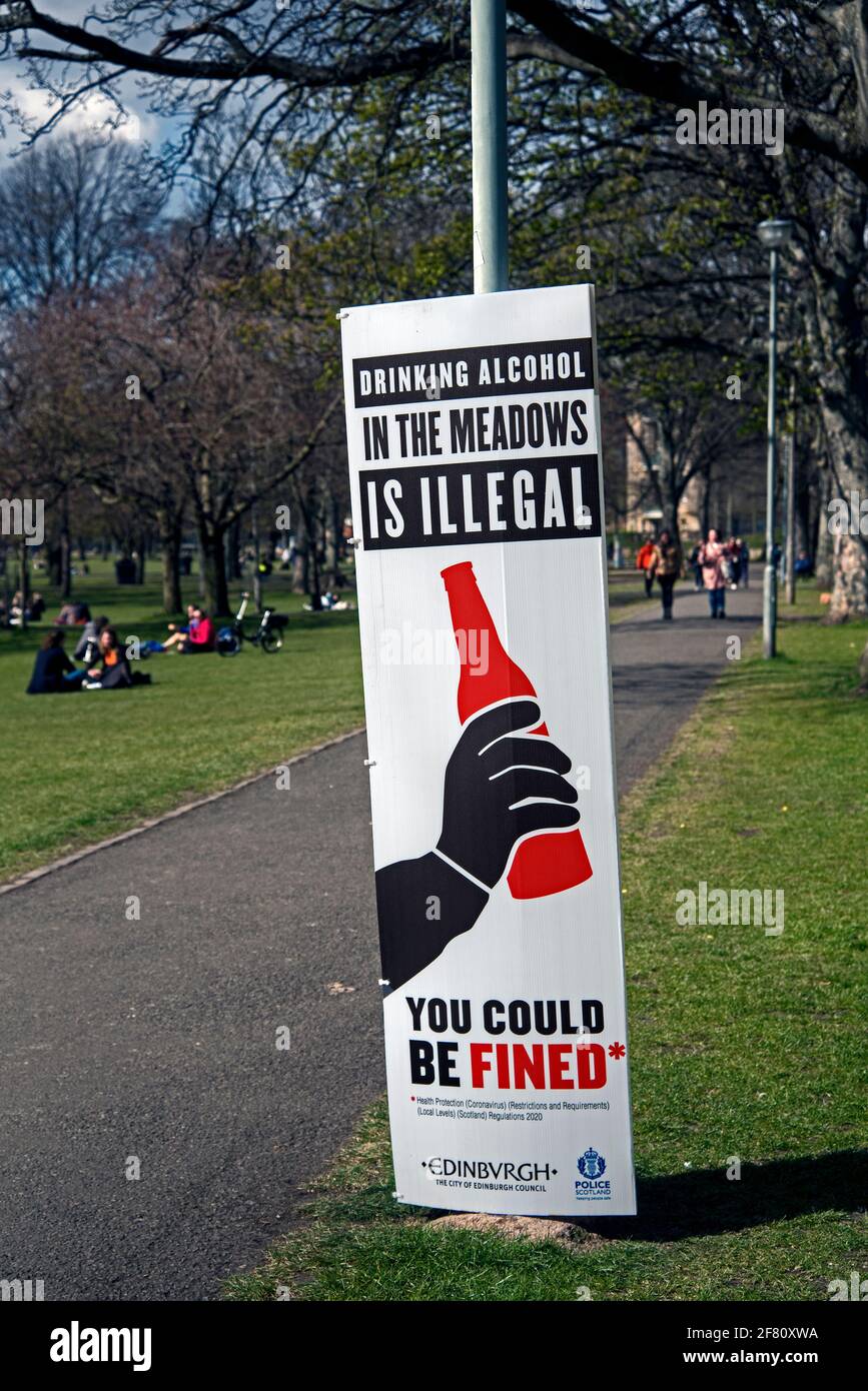 Because of antisocial behaviour the previous week signs have gone up reminding people that it is illegal to drink in The Meadows, Edinburgh. Stock Photo