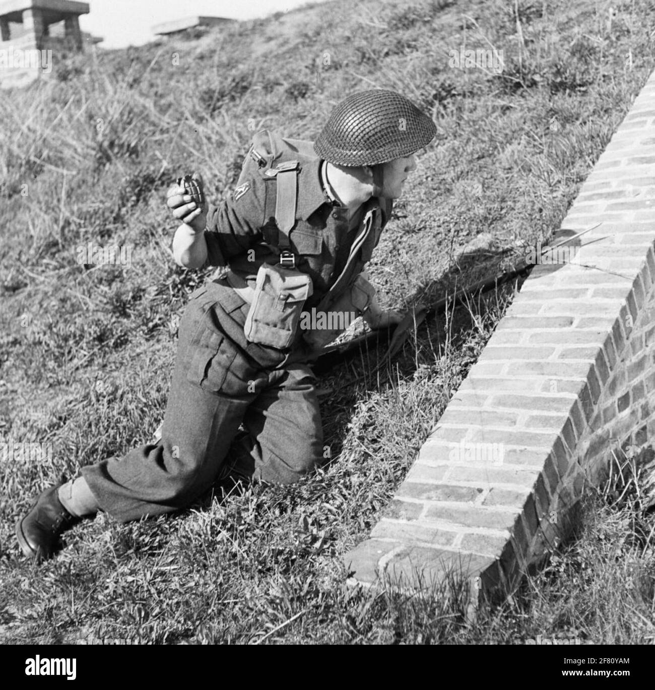 An infanterist ready to throw exercise hand grenade. Stock Photo