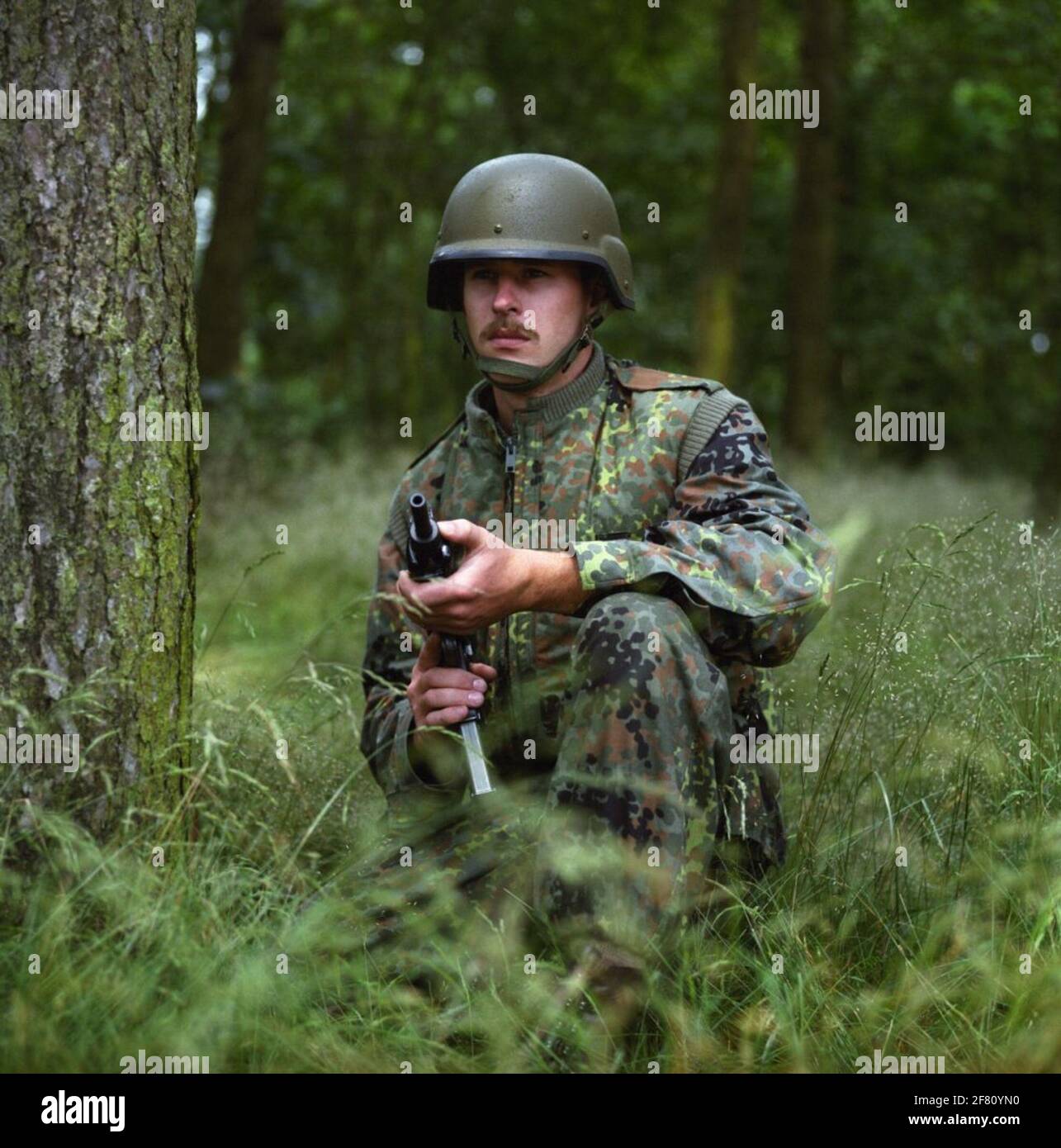 A soldier of the royal army in a test uniform made of material with a stain pattern ('flecktarn') as used by the German army. This type of uniform was not entered. Stock Photo